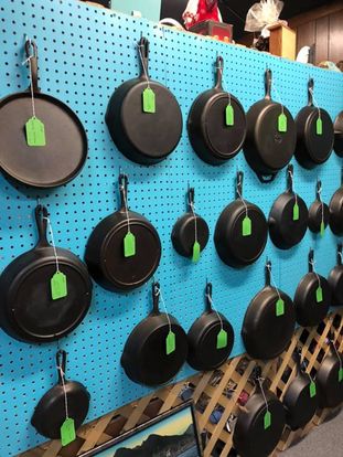 Wall of cast iron pans